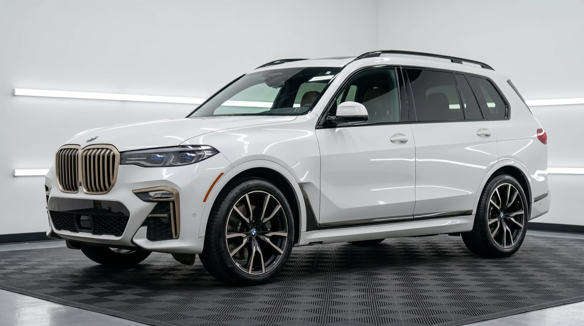 Same BMW X7 after a full detail — mirror gloss under the studio LEDs