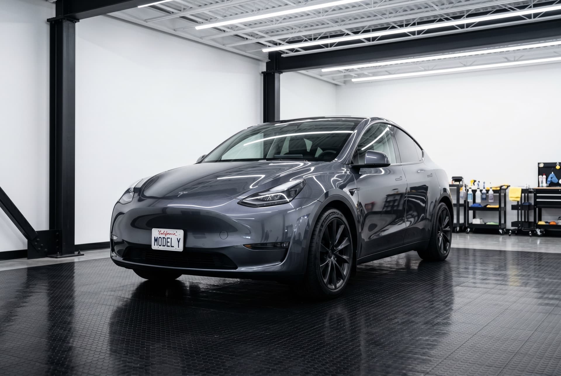 Tesla Model Y in Midnight Silver Metallic, three-quarter front view